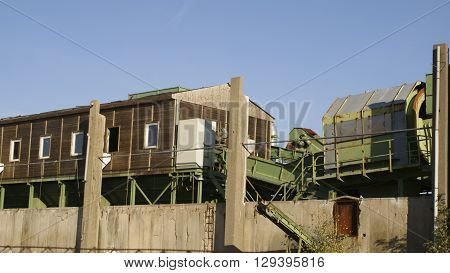 old waste sorting in an industrial ruin with no roof