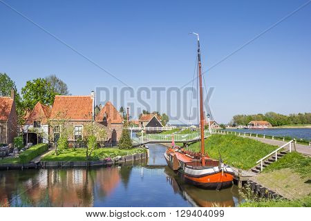 Old sailing ship in a canal in Enkhuizen Netherlands