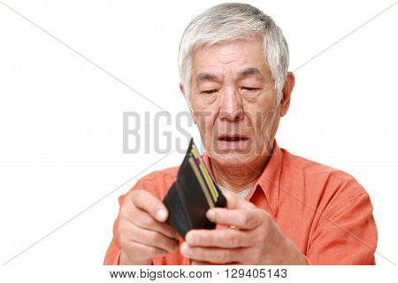 portrait of poor senior Japanese man on white background