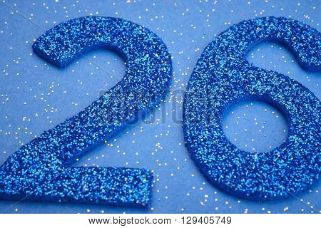 Number twentysix blue color over a blue background. Anniversary. Horizontal
