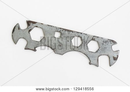 An old multi-dimension spanner on a white background