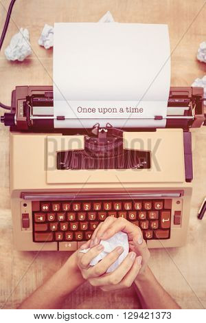 The word once upon a time against above view of old typewriter