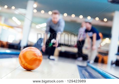 Friends having fun while bowling and speding time together