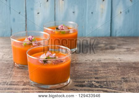 Gazpacho soup in glass on rustic wood
