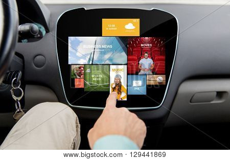 transport, driving, technology, media and people concept - close up of male hand using virtual internet applications on car computer screen