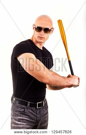 Violence and aggression concept - furious screaming angry man hand holding baseball sport bat in black t-shirt
