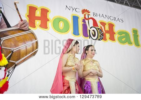 NEW YORK - APR 30 2016: Two dancers on stage at the 7th annual Holi Hai Festival of Colors in Dag Hammerskjold Plaza organized by NYC Bhangra in New York on April 30, 2016.