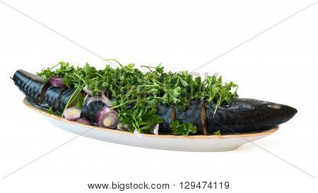 salt mackerel with herbs on a white background