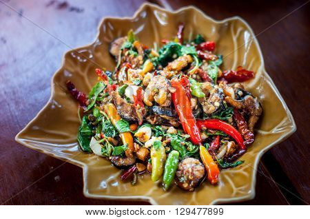 Spicy fried eel on the ceramic plate