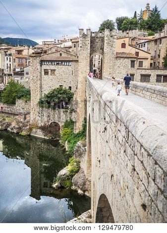 Besalu Spain - August 16 2014 - Crossing the bridge to Besalu