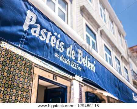 Belem, Portugal - April 28 2014: The main entrance of the Pasteis de Belem (Pastries of Belem) store. The pastries of this shop are well known around the world and a touristic destination.