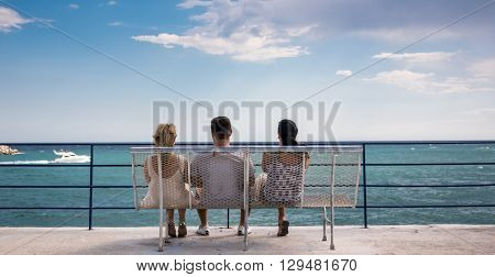 Three amigos watching the boats go by