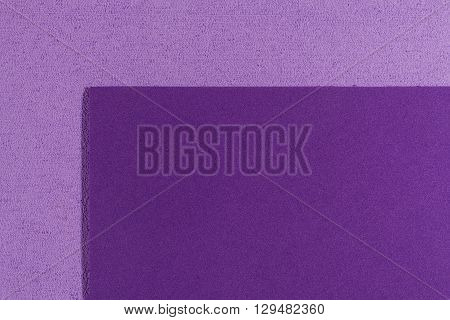 Eva foam ethylene vinyl acetate smooth purple surface on light purple sponge plush background