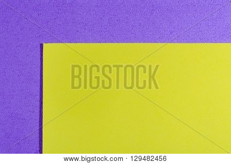 Eva foam ethylene vinyl acetate smooth lemon yellow surface on light purple sponge plush background