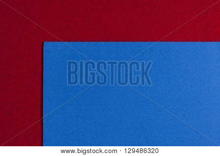 Eva foam ethylene vinyl acetate blue surface on red sponge plush background