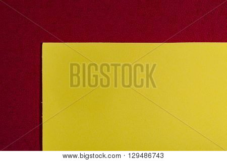 Eva foam ethylene vinyl acetate smooth lemon yellow surface on red sponge plush background