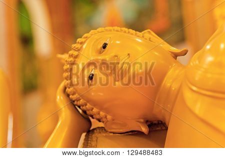 Focus of reclining Buddha statue in temple of Thailand