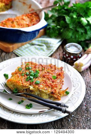 Potato - Kugel Casserole. Jewish cuisine. wooden table