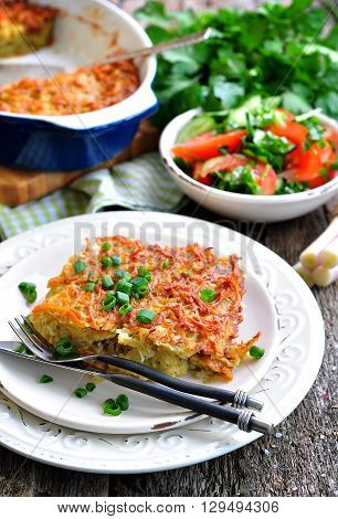 Potato - Kugel Casserole. Jewish cuisine. wooden table