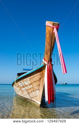 CRABI PROVINCE THAILAND - FEBRUARY 04 2015: Traditional thai long tail boat waiting for tourists to travel to beautiful islands in Thailand