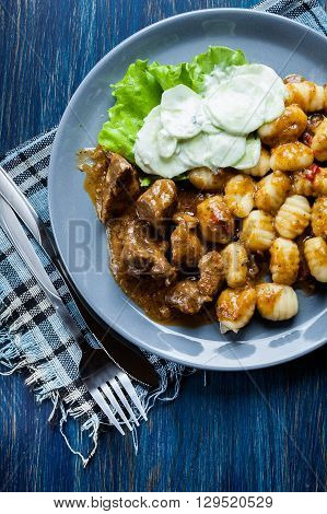 Italian Potato Dumplings With Stew And Cucumber Salad