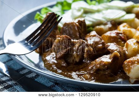 Italian Potato Dumplings With Stew And Cucumber Salad