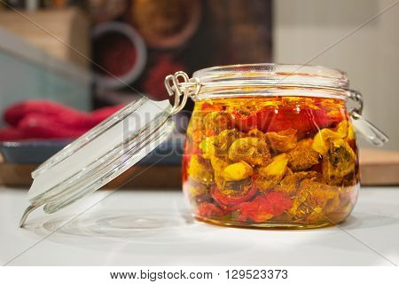 homemade dried tomatoes in clear glass jar