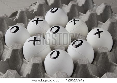 WIN. Drawing on white eggs - tic-tac-toe game