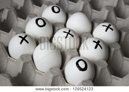 WIN. Drawing white on eggs - tic-tac-toe game