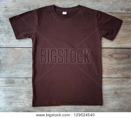 Top View Of Color T-shirt On Grey Wood Plank