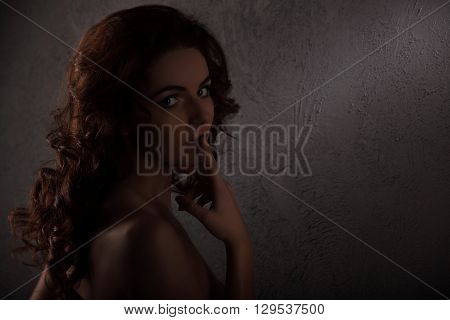 Nude Body Of The Beautiful Girl Over Dark Background