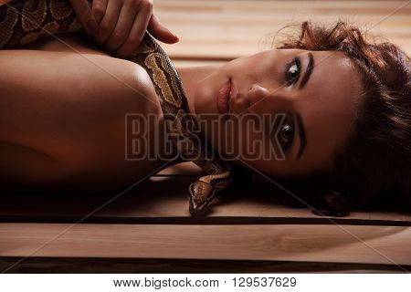 Sexy Brunette Girl With Orange Python Around Her Neck