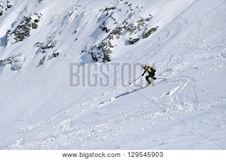 FAGARAS ROMANIA - MARCH 5: Ski mountaineer competes during the Ski Mountaineering National Competition in Fagaras Mountains Carpathian Range on March 5 2016 in Romania.
