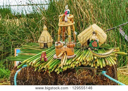 Model of the Floating Island and the house of Uru people at Los Uros in Lake Titicaca Puno Peru