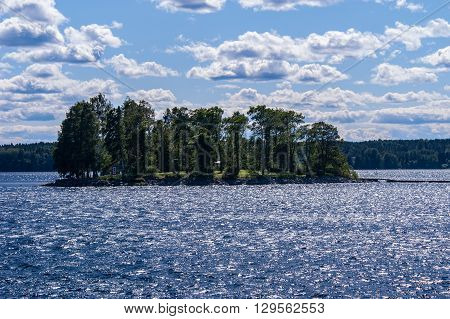 Island in bright sunlight with glittering water