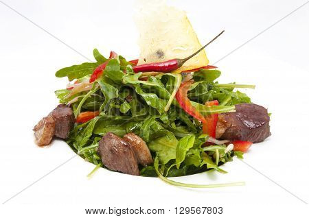 duck with arugula on a white background in the restaurant