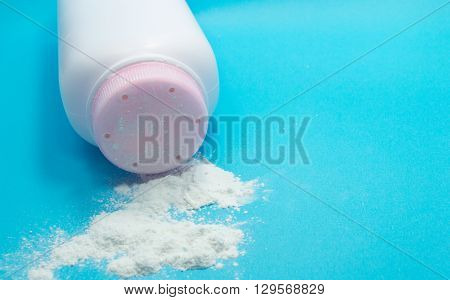 Baby talcum powder container on blue background