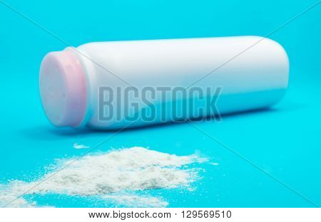 Baby talcum powder container on blue background