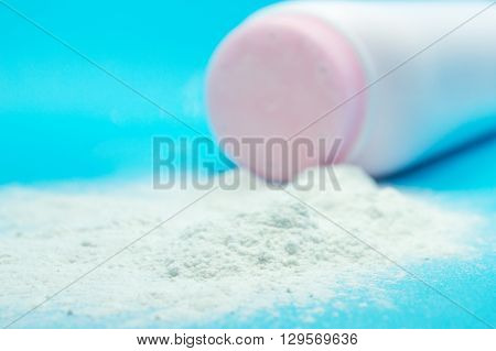 Baby talcum powder container on blue background