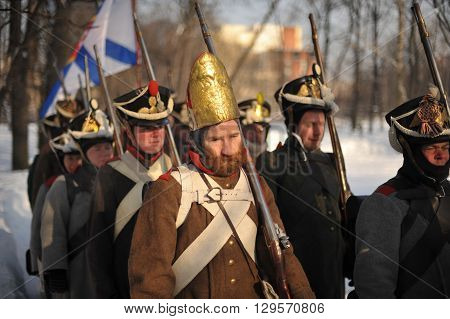 Saint-Petersburg Russia - February 23 2016: Reconstruction of the battle Russian grenadiers against the army of Napoleon . War of 1812. City park.