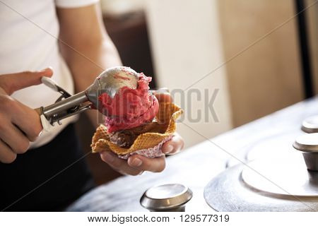 Cropped Image Of Waiter Serving Chocolate And Strawberry Ice Cre