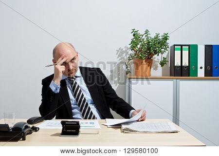 Manager thoughtfully in a negotiation. He is focused.