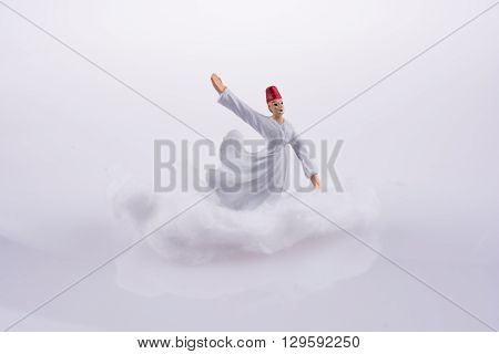 Sufi Derviş on a Cloud on a white background