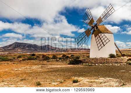Traditional Windmill With Mountain In The Background - Fuerteventura Canary Islands Spain