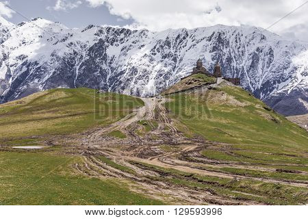 Georgia Stepantsminda-Sameba. Ancient Gergeti Trinity Church high in the mountains.