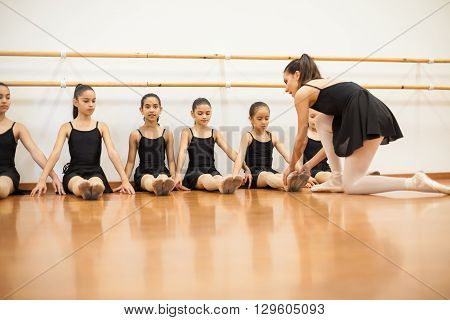 Dance Instructor Teaching A Ballet Class