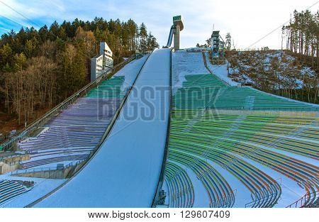 Innsbruck Austria - February 8 2010: The snowy Bergisel skijamping stadium at sunset