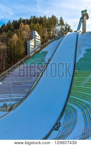 Innsbruck Austria - February 8 2010: The snowy Bergisel skijamping stadium at sunset