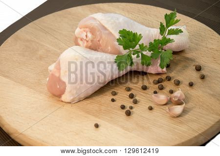 Raw chicken wings with green salad, high angle view, clipping path included