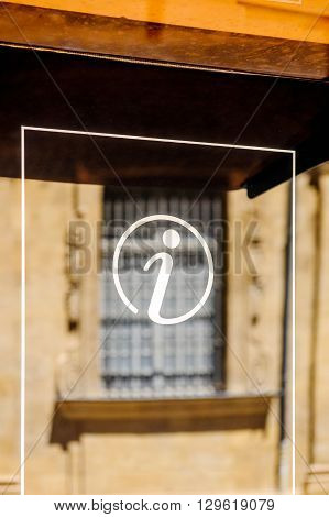 Information sign icon in city environemnt with beautiful defocused window in the background